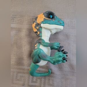 Fingerlings Dinosaur Interact Action Figure - Green, Orange, and Black